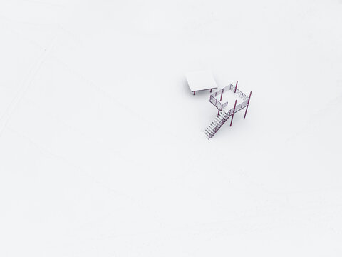 Aerial view of snow-covered stairs leading to the Baltic Sea in a serene winter landscape, Parnu, Parnu County, Estonia.