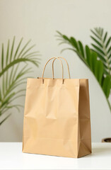 Brown paper shopping bag next to a green plant against a neutral background. Eco-friendly shopping.
