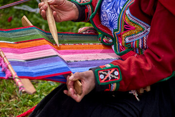 The hands of a weaver hold generations of skill, patience, and creativity, turning simple strands into works of art. Each weave is a journey, each knot a memory.  Chinchero Cusco Peru.