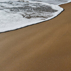 Ocean Waves Meeting Sandy Shore