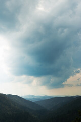 Obraz premium Storm Clouds Over Mountain Landscape
