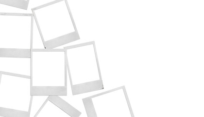 Vacation background: blank polaroid photos randomly laid out on a surface on the left against an...