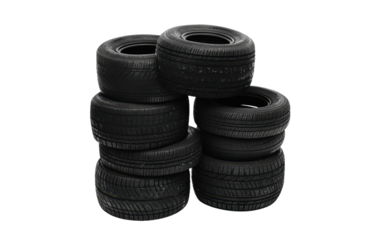 A stack of black tires arranged in a pyramid shape on a white background showing their tread patterns well