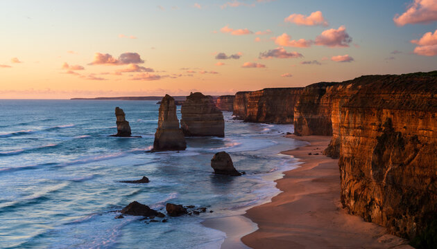 Stunning view of   The Twelve Apostles, with the beautiful sunset colours on  the cliffs