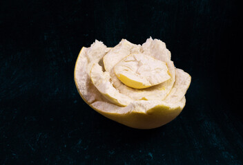 Pamelo skin on a black background