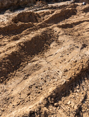 hole in the ground on the site of which a highway was started