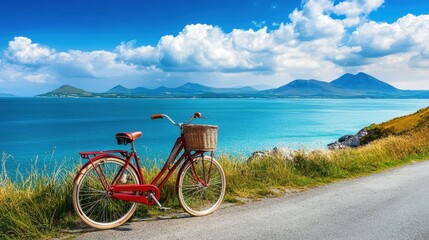 Fototapeta premium A vintage bicycle parked beside a scenic coastal road, overlooking the endless blue ocean