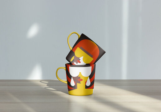 Mockup of Modern Mugs With Handles stacked atop each other on a light wooden surface