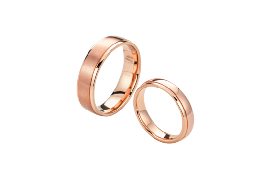 A pair of rose gold rings—one brushed, one polished—symbolizing love’s balance between elegance and subtlety, reflecting timeless commitment in warm metallic tones, isolated on transparent background