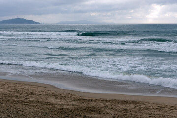 The beach at high tide in the early morning, photographed in Haitang Bay, Sanya, Hainan, China.