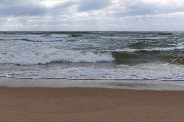 The beach at high tide in the early morning, photographed in Haitang Bay, Sanya, Hainan, China.