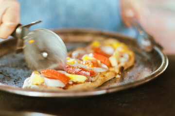 Sliced and served hawaiian mini pizza