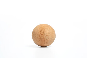 Wooden sphere on a white background. Close up of light brown wooden ball. Organic, design and minimalist decor concept