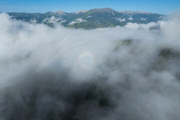 Aerial view of beautiful high altitude grassland mountain in fog landscape