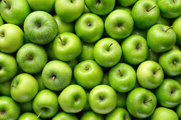 A close-up view of fresh green apples, showcasing their shiny skin and vibrant color. Perfect for food photography, healthy lifestyle, and fruit-related content.