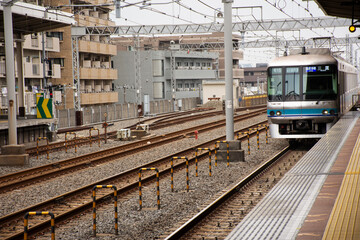 Japanese people and foreign traveler passengers wait and walking up and down journey with MRT Tozai...
