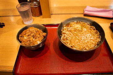 Japanese food set meat gyudon with rice or garlic fried rice recipe beef and ramen clear soup of local restaurant shop in Ariake train JR railway Station in Koto City, Tokyo, Japan