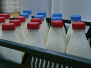Milk bottles red and blue plastic caps