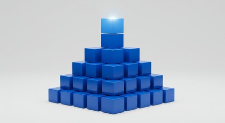 Obraz premium Blue Cubes Pyramid Structure - A pyramid of blue cubes, with a lighter blue cube at the peak, symbolizes growth, success, and achievement