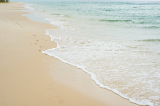 Beautiful clear water lapping the shore at the beach