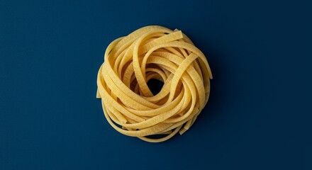 Nest of Tagliatelle Pasta - A single portion of dried tagliatelle pasta, neatly nested on a deep blue background. Ready for cooking