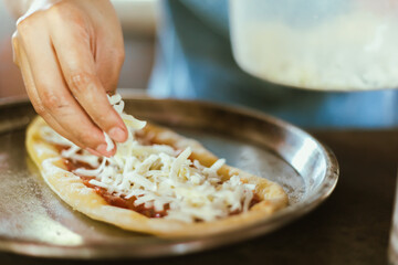 hand making an Italian pizza .