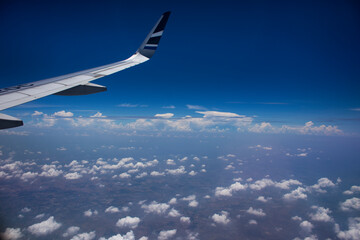 Aerial view landscape cloud sky from airbus flying from Yichang Sanxia Airport for bring chinese travelers and thai people passengers go to Don Mueang international airport in Bangkok city at Thailand