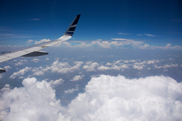 Aerial view landscape cloud sky from airbus flying from Yichang Sanxia Airport for bring chinese travelers and thai people passengers go to Don Mueang international airport in Bangkok city at Thailand