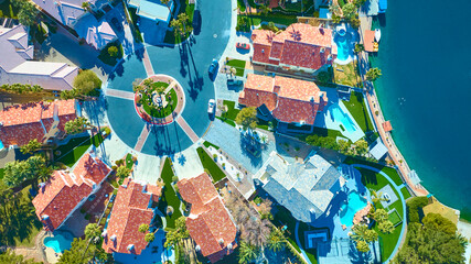 Aerial Top Down of Mediterranean-Style Neighborhood with Cul-De-Sac and Lagoon