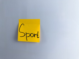 Motivational word written on sticky note to motivate start sport exercise