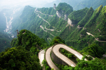 View landscape range mountain and road 99 curve turn for chinese people travelers travel visit Tianmen Shan cave Heaven Gate in Tianmenshan Mountain National Forest Park at Zhangjiajie in Hunan, China