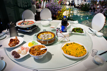 Traditional chinese food gourmet meal set or local cuisine meal cultural tribe food on table for serve customers people travelers taste eat and tasty drink in restaurant at Zhangjiajie in Hunan, China