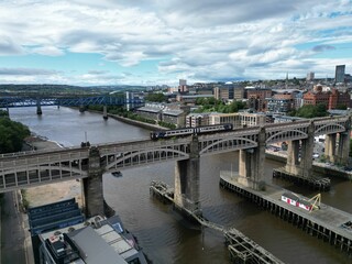 Aerial view of Newcastle upon Tyne featuring a train crossing the iconic High Level Bridge