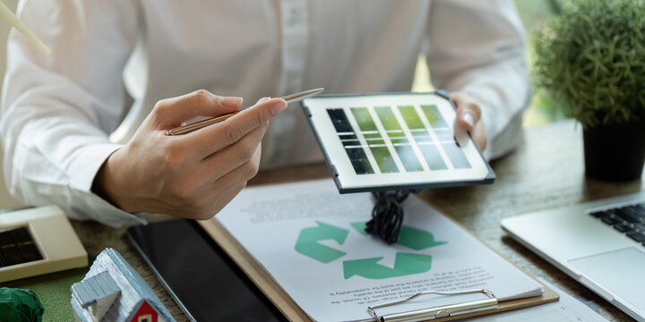 Solar Energy and Sustainable Practices. An expert presents innovative solar panel designs to colleagues.