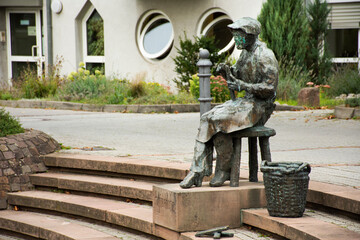 Art old human statue at outdoor in Sandhausen village of Heidelberg, Germany