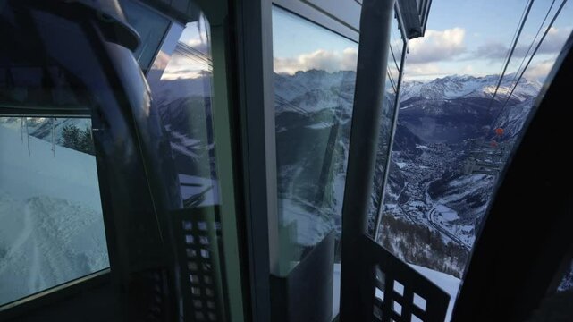 Onboard view of Skyway Monte Bianco cable car from Pavillon and peaks on Italian French border at sunset, Courmayeur, Aosta Valley, Italian Alps, Italy