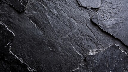 Black stone with grey cement texture, clean and minimal flat lay composition, conveying simplicity and modern elegance.