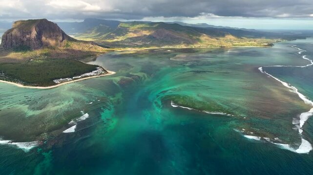 Aerial view of Mauritius island and Le Morne Brabant mountain with beautiful lagoon and underwater waterfall illusion