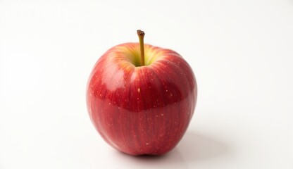 Fresh red apple on white background highlighting its glossy surface and vibrant color
