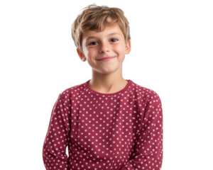 cheerful boy wearing polka dot pajama shirt, smiling warmly. His light brown hair and bright eyes add to joyful expression, creating playful and inviting atmosphere
