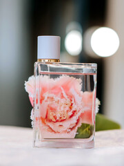 transparent perfume bottle on a tulip background