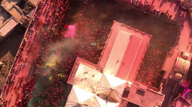 Devotees celebrate Holi at Nandgaon temple , with colors