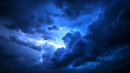 Obraz premium Dramatic blue thunderstorm clouds with lightning illuminations