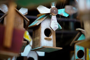 Colorful Wooden Birdhouses Hanging with Rustic Charm and Whimsy