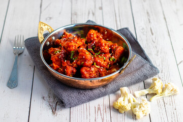 Gobi Manchurian is a crispy, spicy Indo-Chinese dish made with battered, fried cauliflower tossed in a tangy, flavorful soy-garlic sauce.