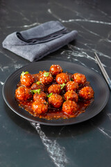 Vegetable Manchurian is a spicy Indo-Chinese dish featuring deep-fried vegetable balls tossed in a...