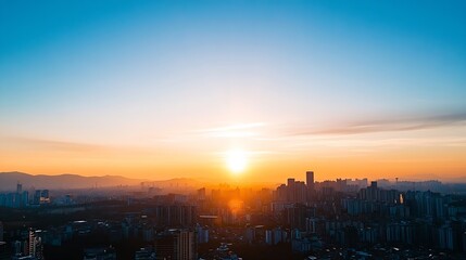 Stunning sunset view over a vibrant city skyline with clear blue sky and distant mountains : Generative AI