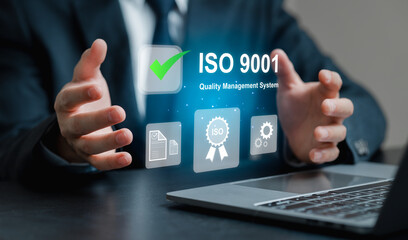 Businessman Presenting ISO 9001 Quality Management System Concept
