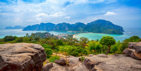 Phi-Phi island viewpoint Krabi Province, Thailand. Famous Koh Phi-Phi Don island with white sand beach and turquoise water under blue sky. Panoramic view of Phi Phi island in Krabi, Thailand