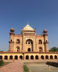 Safdarjung Tomb in Delhi, India. Mughal architecture under a clear blue sky.